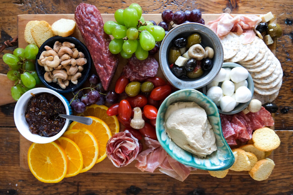 Dips for Charcuterie Boards: Hummus and jam served on a charcuterie board